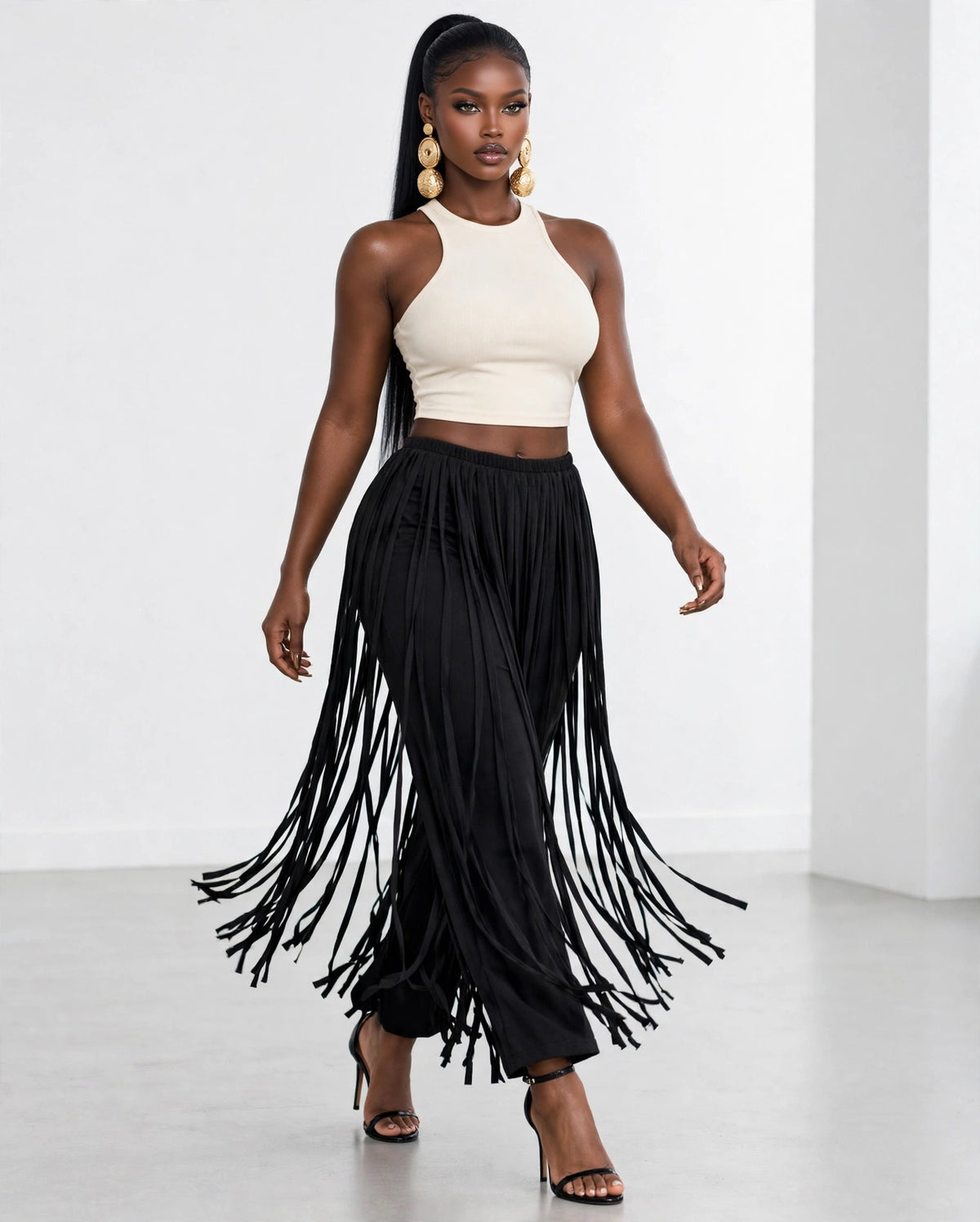 Fringe Overlay Pant in black, worn in a stride